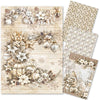 Set of decorative paper sheets with winter-themed designs featuring snowflakes, pinecones, and birds.