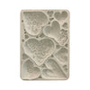 Decorative silicone mold with butterfly and heart designs on a white background