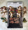 Decorative angel moulage set with packaging on a decorative background