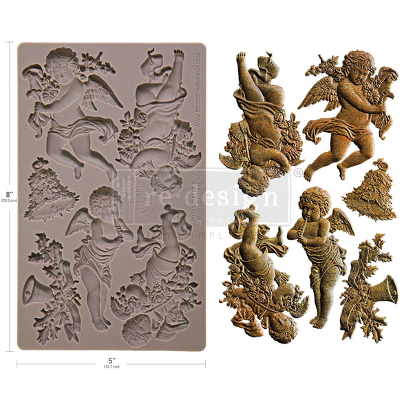 Silicone mold with angel designs and finished angel figurines on a white background