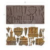 Chocolate mold with various shapes and a set of molded chocolate pieces on a white background.