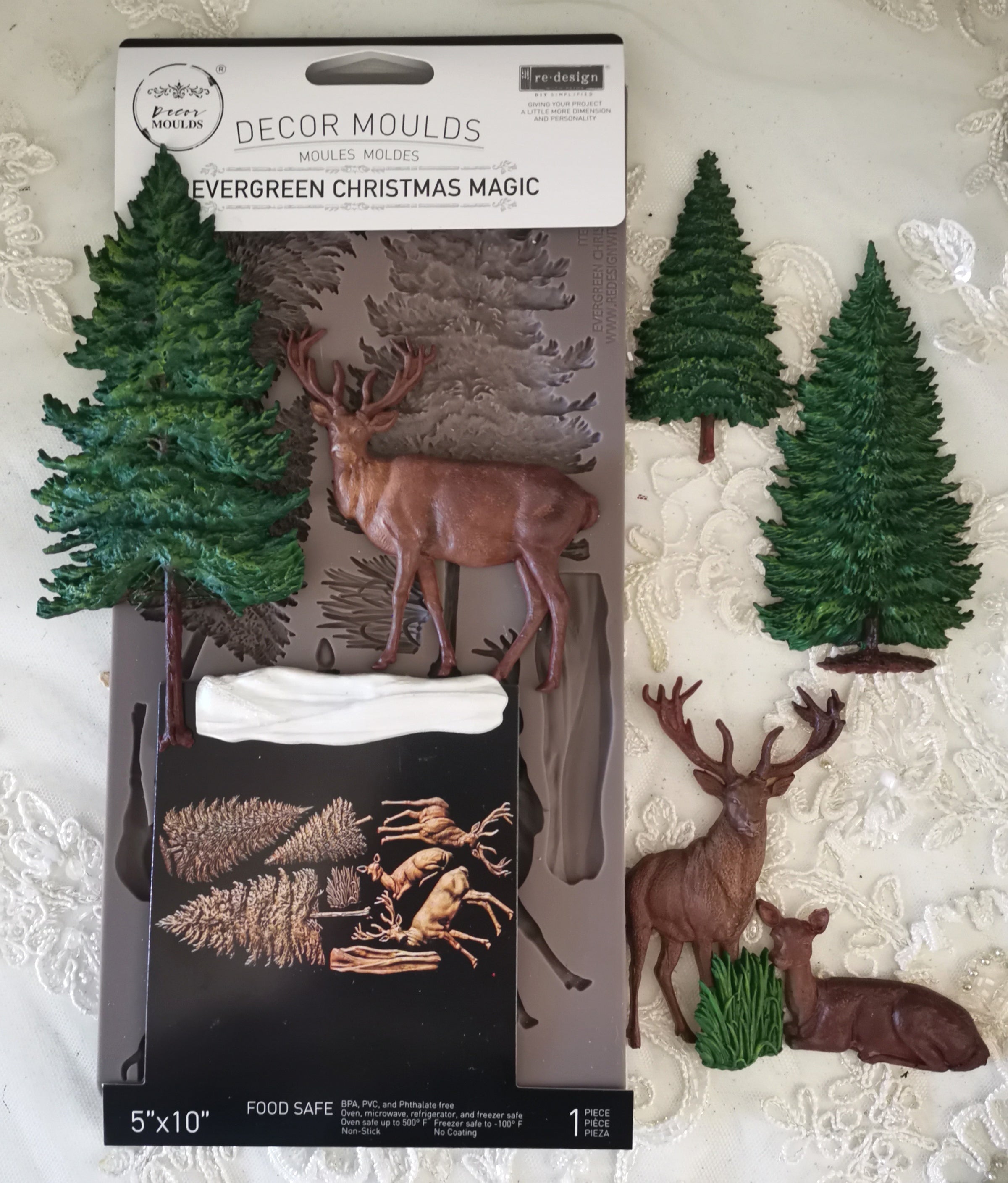 Decor moulds packaging with trees and deer on a textured surface