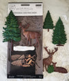 Decor moulds packaging with trees and deer on a textured surface