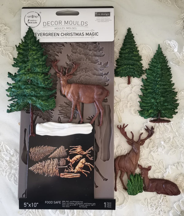 Decor moulds packaging with trees and deer on a textured surface