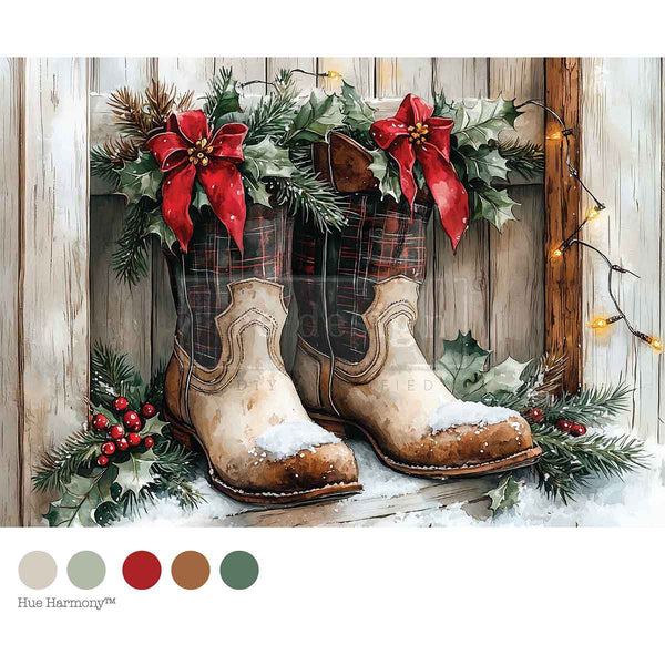 Pair of rustic cowboy boots with plaid pattern, surrounded by Christmas decorations on a wooden background.