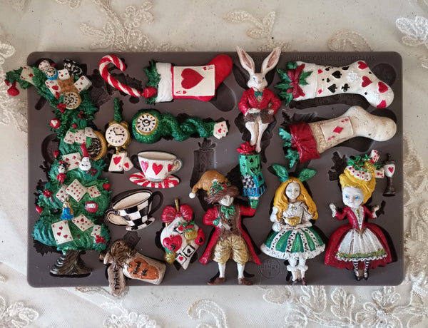 Collection of decorative figurines inspired by Alice in Wonderland on a dark surface.