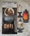 Decorative mold packaging with sample molds and a candle on a decorative background