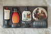 Decorative mold set with candle, lantern, and couple design on a textured surface.