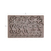 Silicone mold with floral and bow designs and measurements on a white background