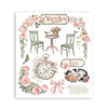 Decorative print with floral arch, chairs, clock, and 'La Vie en Rose' text on a white background.