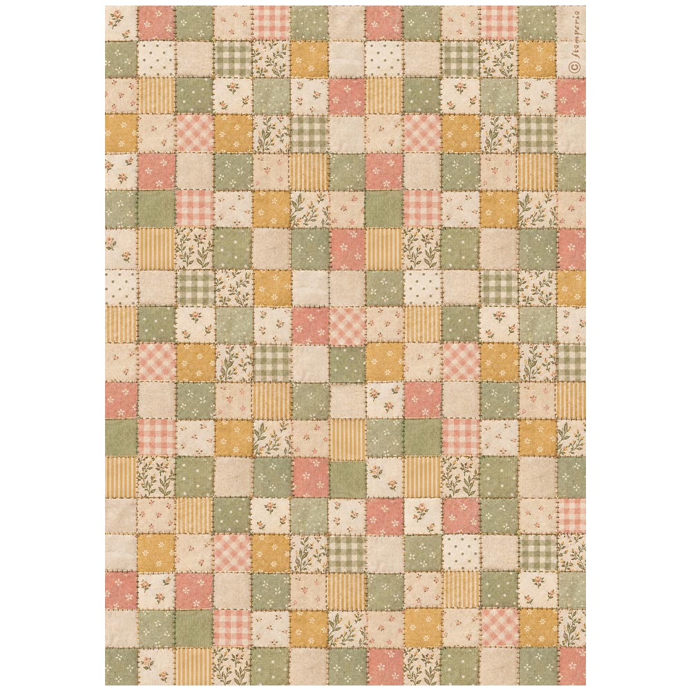 A rectangular patchwork quilt or rug featuring a grid of small square fabric panels in muted tones of sage green, dusty pink, mustard yellow, and cream, with various patterns including gingham, stripes, florals, and dots.
