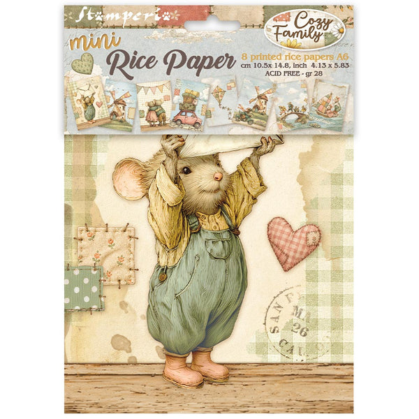 A package of 'mini Rice Paper' by 'Cozy Family' featuring a vintage-style illustration of a small mouse in green overalls and a yellow shirt, holding a hat above its head. The packaging includes a header card with illustrations of other stamping papers and product details.