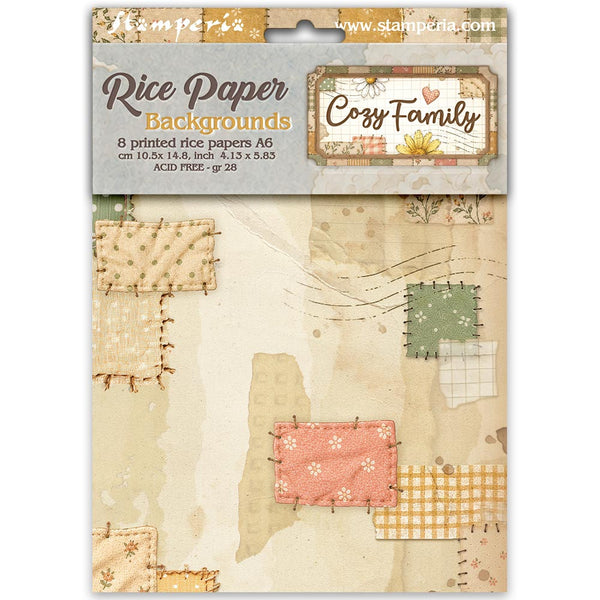Stamperia Rice Paper Backgrounds 'Cozy Family' pack containing 8 printed rice papers in an A6 size sheet, featuring a patchwork design with beige, pink, green, and yellow patterns on a light gray background.