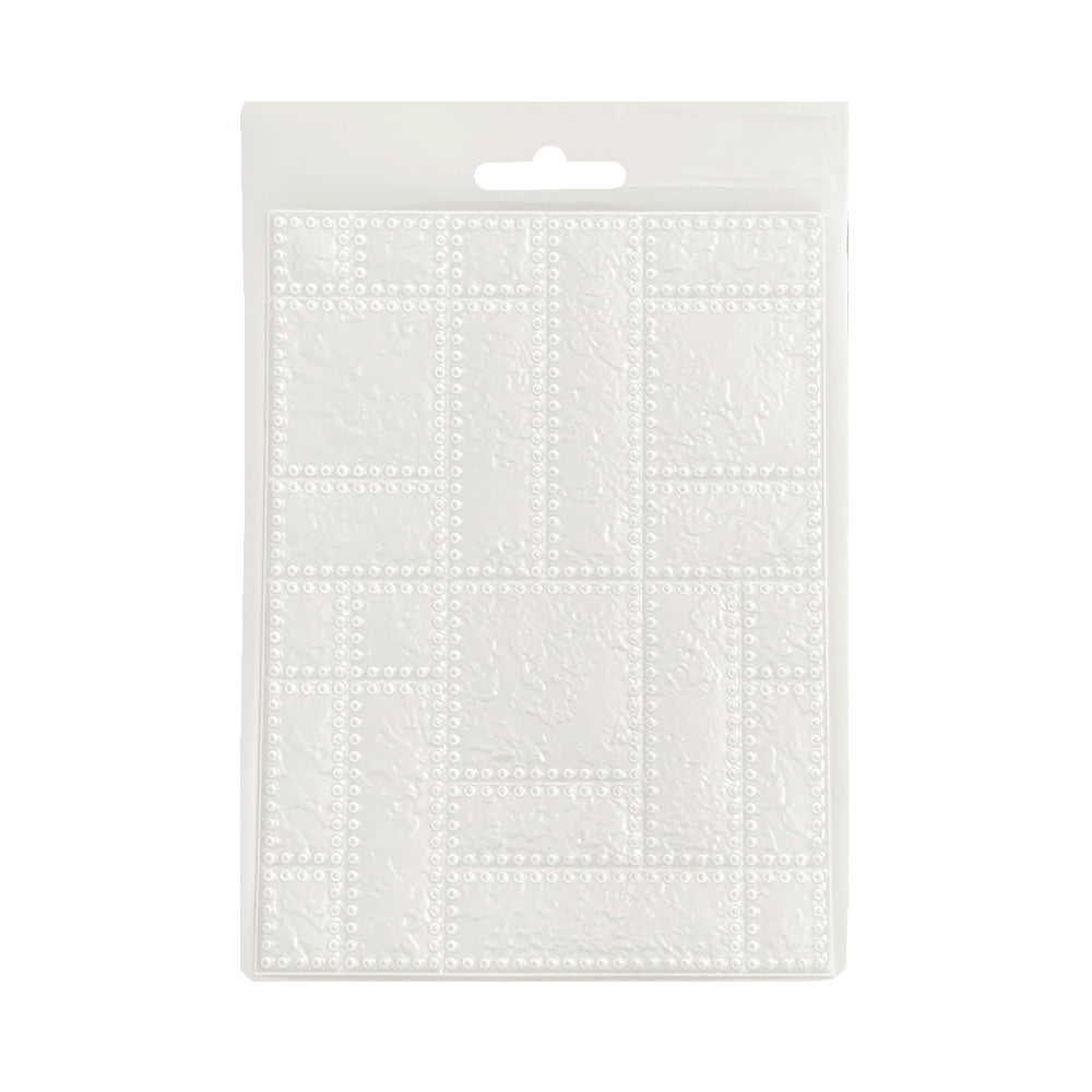 Clear plastic impression mould on a white background