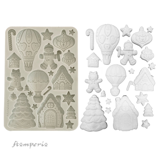 Silicone mold with Christmas-themed shapes and corresponding white silicone molds on a white background.