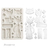 Silicone mold with cat-shaped cavities and decorative elements on a white background
