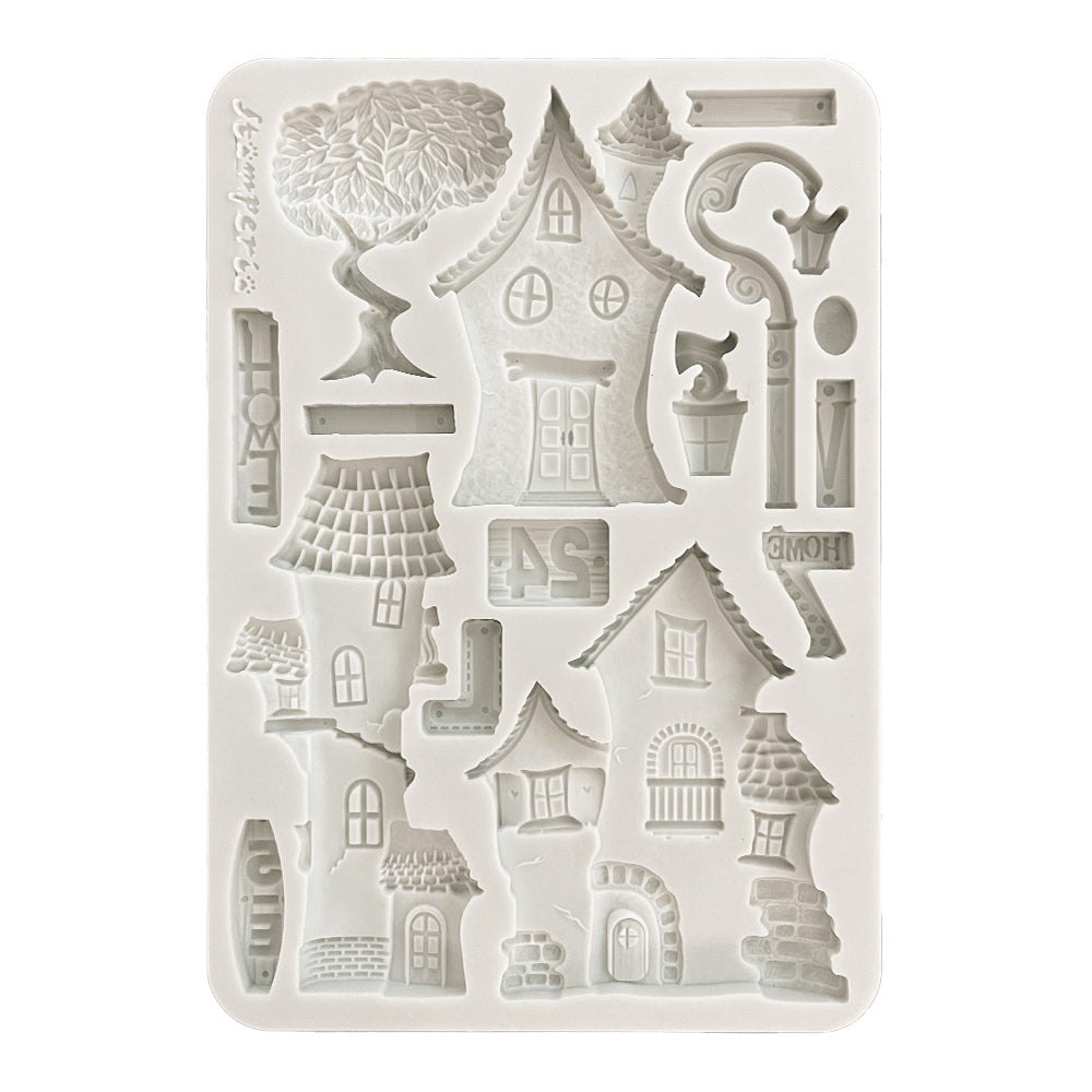 Silicone mold with house and tree designs on a white background