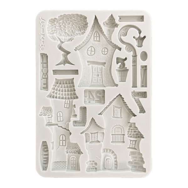 Silicone mold with house and tree designs on a white background
