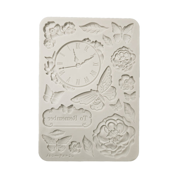 Decorative mold with clock design, flowers, and butterflies on a white background