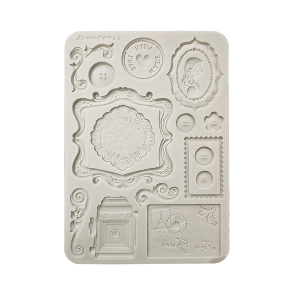 Decorative silicone mold with intricate designs on a white background