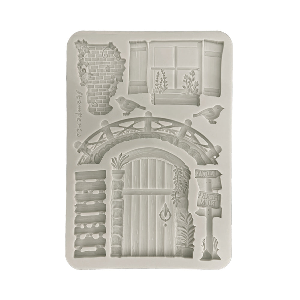 Silicone mold with garden-themed design on a white background