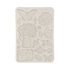 Decorative silicone mold with floral and butterfly designs on a white background