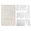 Set of white art supplies including brushes, scissors, and frames on a white background
