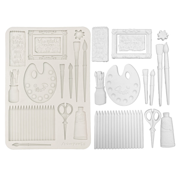 Set of white art supplies including brushes, scissors, and frames on a white background