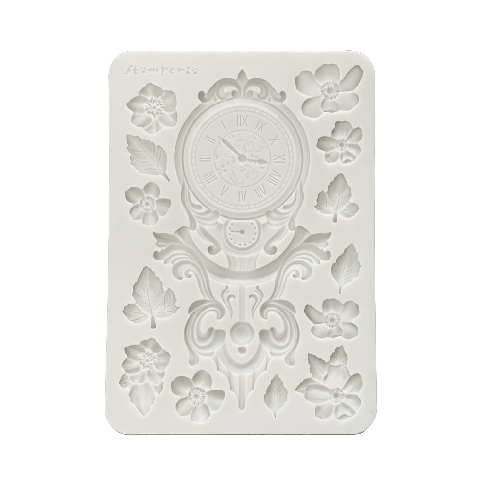 Decorative silicone mold with clock design on a white background