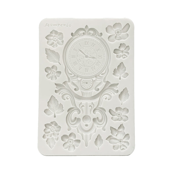 Decorative silicone mold with clock design on a white background