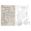 Silicone mold with musical instrument shapes on a white background