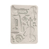 Silicone mold with musical instrument shapes on a white background