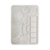 A rectangular white silicone mold with embossed travel-themed designs including a camera, flowers, boots, film reels, and a bus, shown on a plain white background.