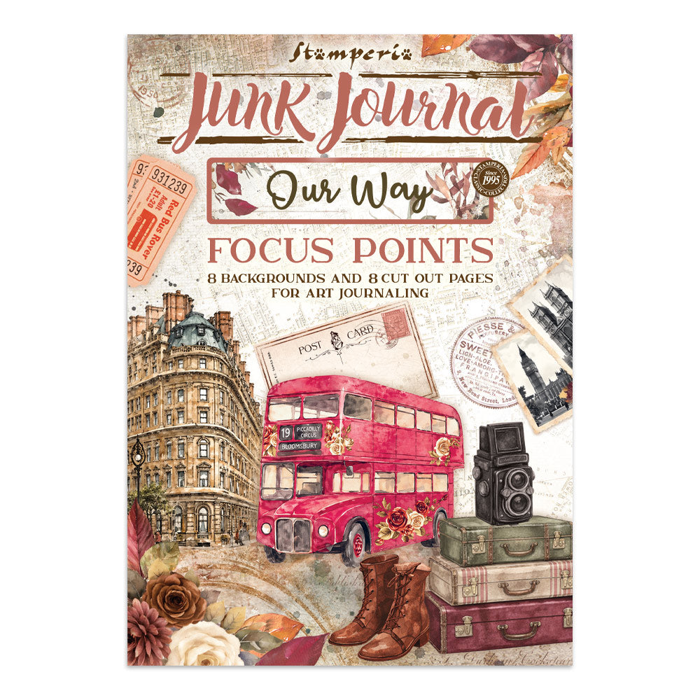 Front cover of a stamperia 'Junk Journal' art journal titled 'Our Way Focus Points'. The cover features a collage of vintage travel-themed illustrations including a red double-decker bus, a classic building facade, stacked suitcases, brown leather boots, a vintage camera, and postcards on a textured cream background.