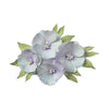 Decorative floral hair clip with light purple flowers and green leaves on a white background