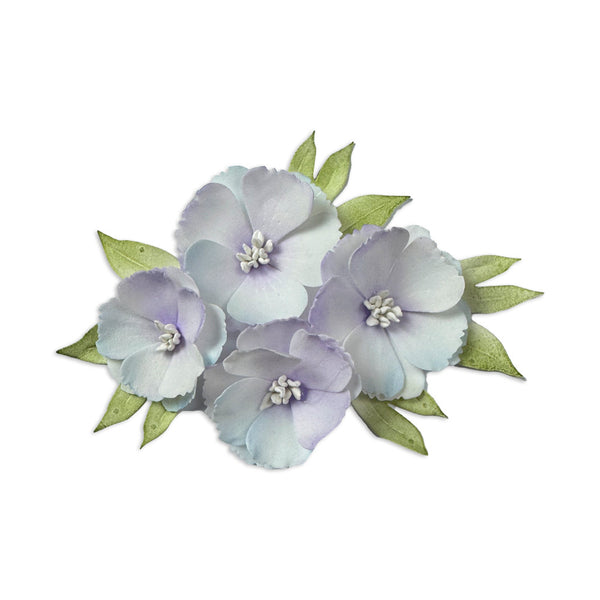 Decorative floral hair clip with light purple flowers and green leaves on a white background