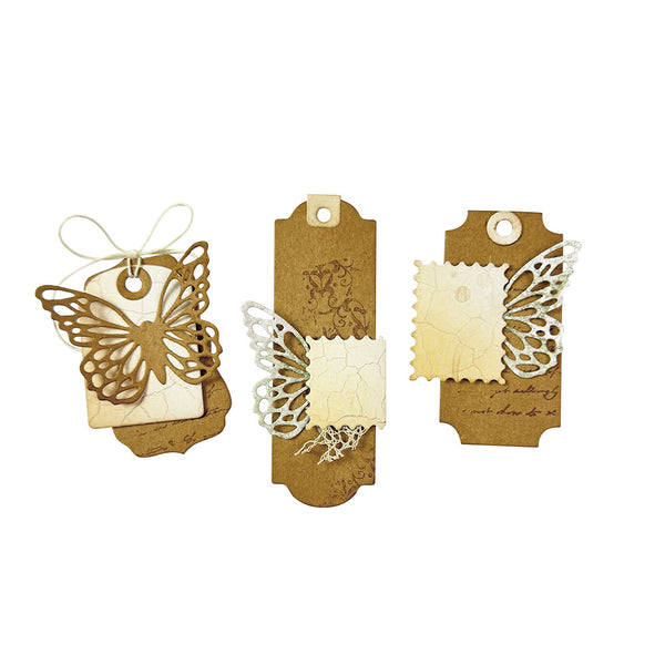 Three decorative paper tags with butterfly designs on a white background