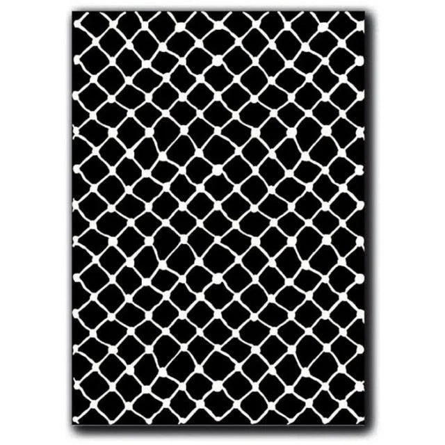Black and white geometric patterned rub on on a plain background