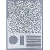 Decorative stencil with floral and border designs on a gray background