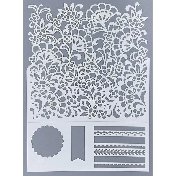 Decorative stencil with floral and border designs on a gray background