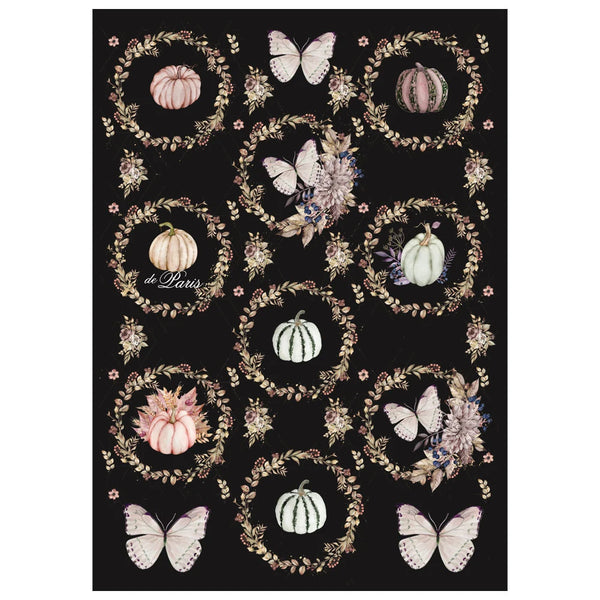 Decorative mat with pumpkins, butterflies, and floral wreaths on a black background