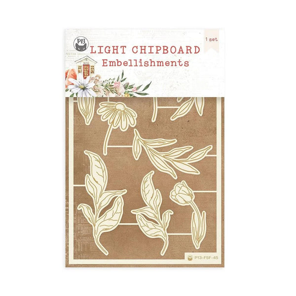 Packaging of light chipboard embellishments with floral designs on a brown background